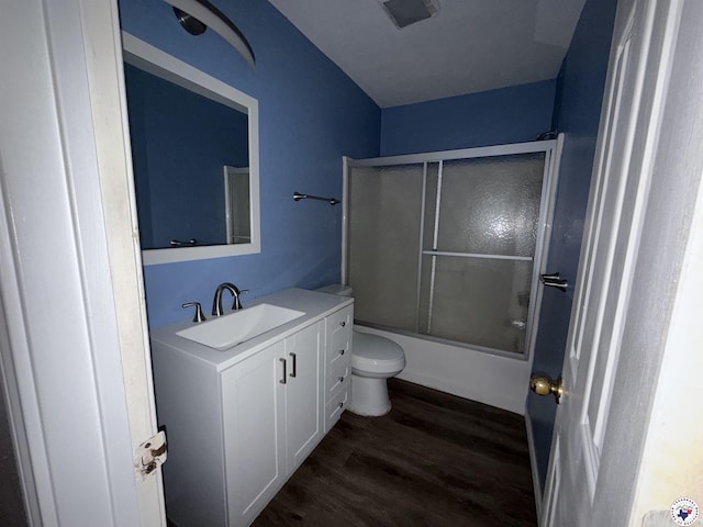909 Pacific Ave, Wake Village, TX 75501 - bathroom featuring vanity, toilet, wood finished floors, and combined bath / shower with glass door