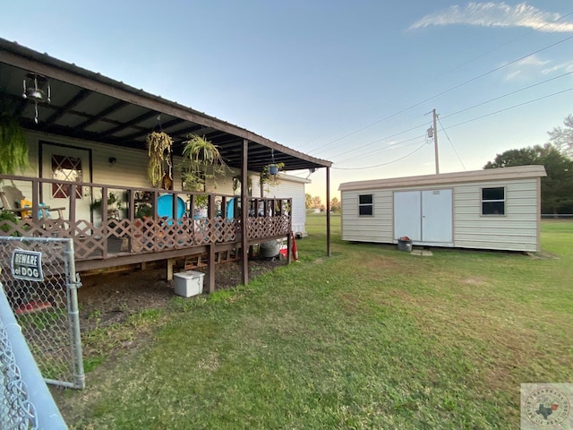 view of yard featuring a shed and a wooden deck