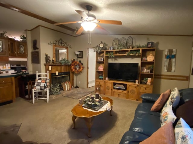 living room with carpet flooring, a textured ceiling, and ceiling fan