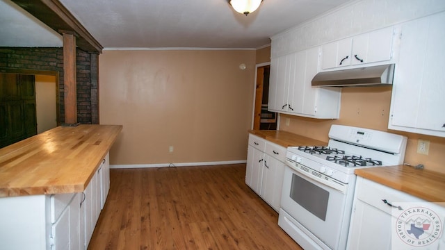 kitchen with light hardwood / wood-style flooring, white cabinetry, ornamental molding, white gas stove, and wood counters