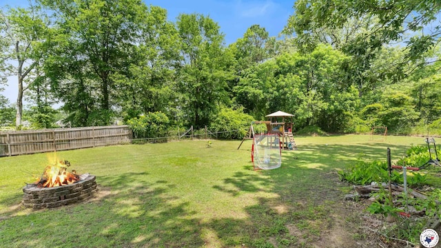 9216 W 7th St, Redwater, TX 75501 - view of yard featuring a playground and a fire pit