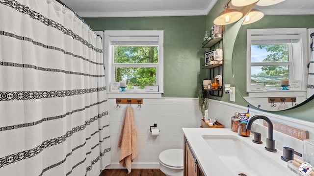 9216 W 7th St, Redwater, TX 75501 - full bath with toilet, crown molding, vanity, a wainscoted wall, and wood finished floors