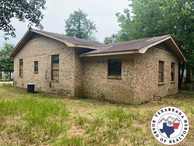 503 Cannon St, New Boston, TX 75570 - view of property exterior featuring brick siding, central AC unit, and crawl space
