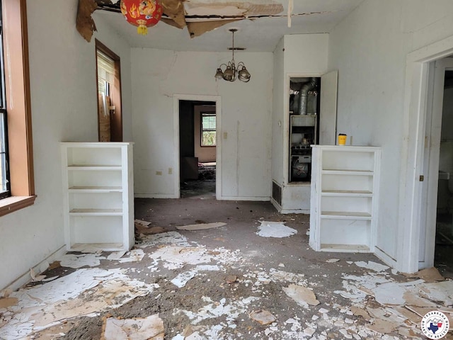 503 Cannon St, New Boston, TX 75570 - unfurnished dining area featuring a chandelier