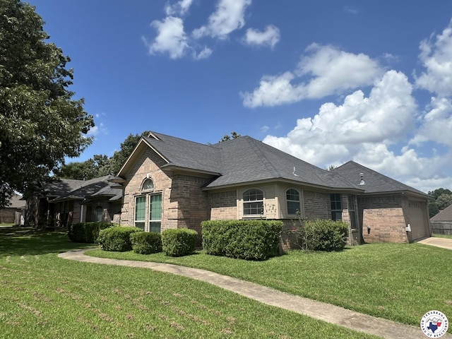 5902 Oak Hollow Pl, Texarkana, AR 71854 - view of front of property featuring brick siding, a garage, and a front lawn