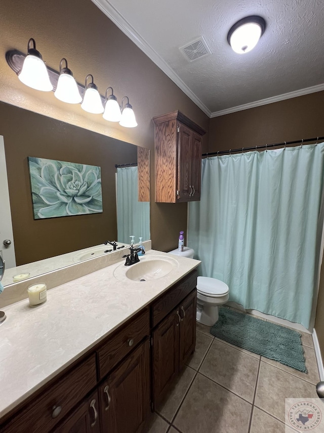 bathroom with crown molding, tile patterned floors, toilet, a textured ceiling, and vanity