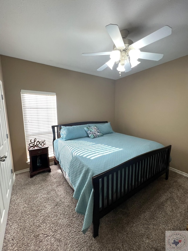 bedroom with ceiling fan and carpet floors