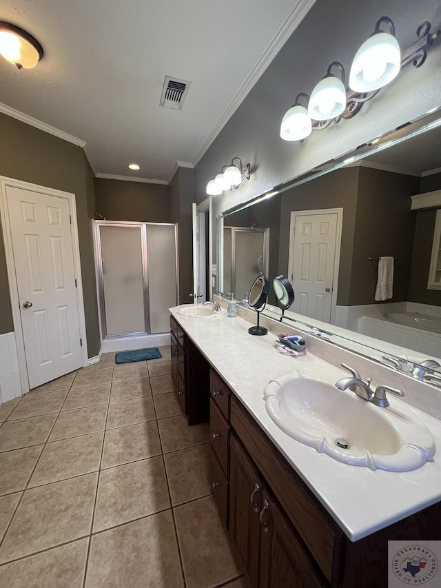 bathroom featuring crown molding, a shower with door, tile patterned flooring, and vanity