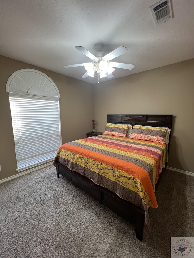 bedroom with ceiling fan and carpet flooring