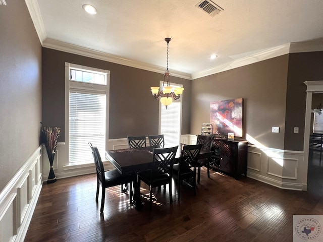 dining room featuring crown molding, an inviting chandelier, and dark hardwood / wood-style floors