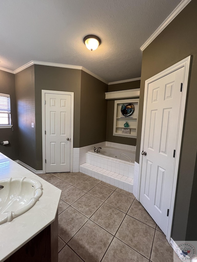 bathroom featuring a relaxing tiled tub, vanity, ornamental molding, and tile patterned flooring