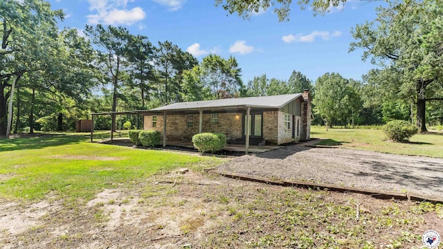 1911 Vanderbilt Rd, Texarkana, AR 71854 - view of green lawn with view of wooded area