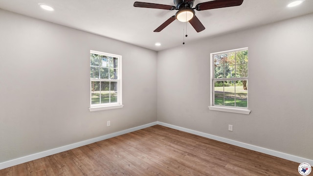 1911 Vanderbilt Rd, Texarkana, AR 71854 - unfurnished room with plenty of natural light, wood finished floors, recessed lighting, and ceiling fan