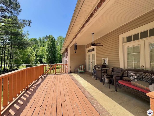 wooden deck with french doors, a grill, and ceiling fan