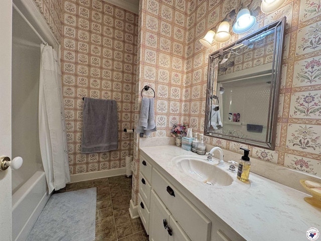 bathroom with tile patterned flooring, vanity, baseboards, and wallpapered walls