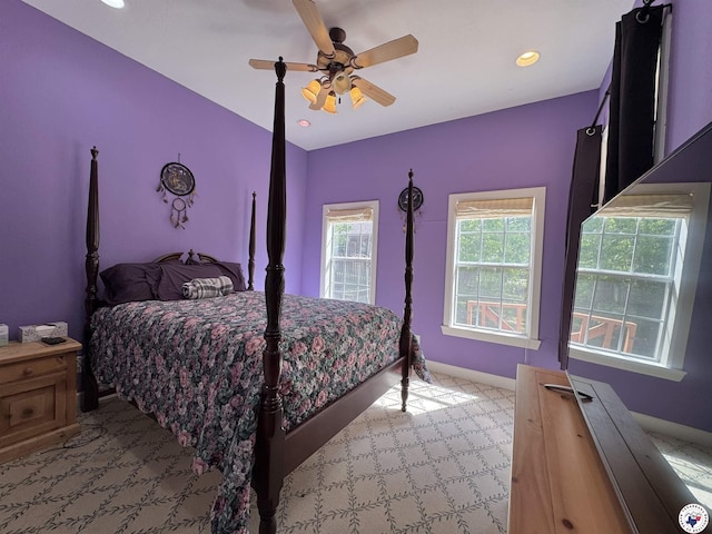 carpeted bedroom featuring recessed lighting, baseboards, and a ceiling fan