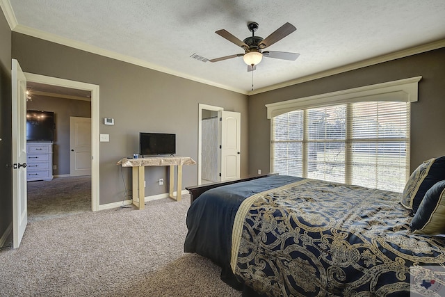 carpeted bedroom with a textured ceiling, ceiling fan, and ornamental molding