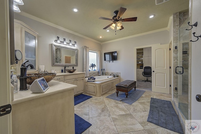 bathroom featuring tile patterned floors, ornamental molding, vanity, ceiling fan, and separate shower and tub