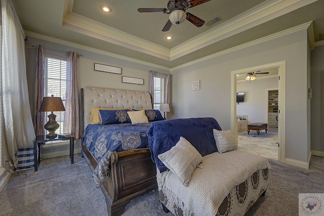 bedroom featuring ceiling fan, a tray ceiling, carpet, and ornamental molding