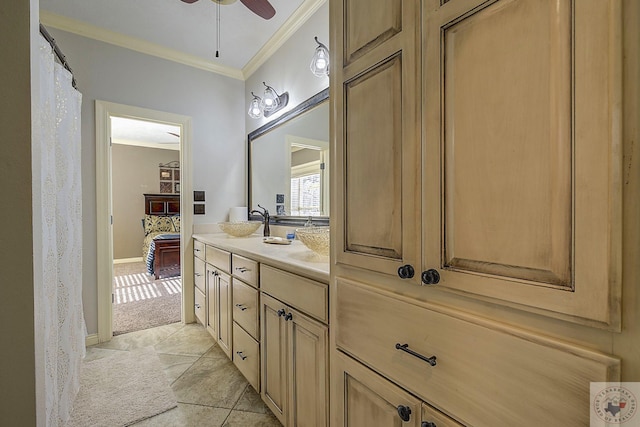 bathroom featuring vanity, ceiling fan, ornamental molding, and tile patterned flooring