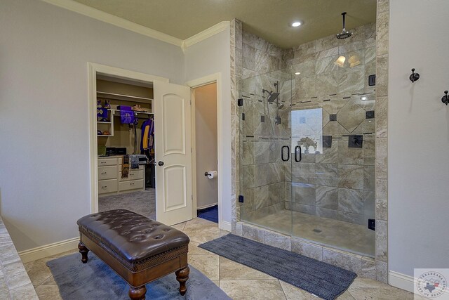 bathroom featuring an enclosed shower, crown molding, and tile patterned flooring