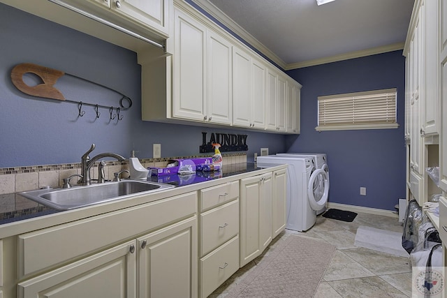 washroom featuring sink, independent washer and dryer, light tile patterned floors, cabinets, and ornamental molding