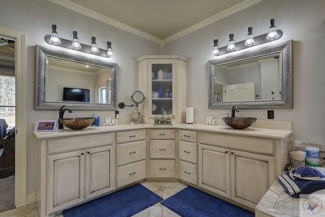 bathroom featuring tile patterned floors, vanity, and ornamental molding