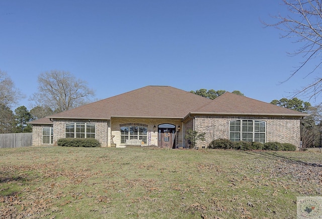 ranch-style home with a front lawn