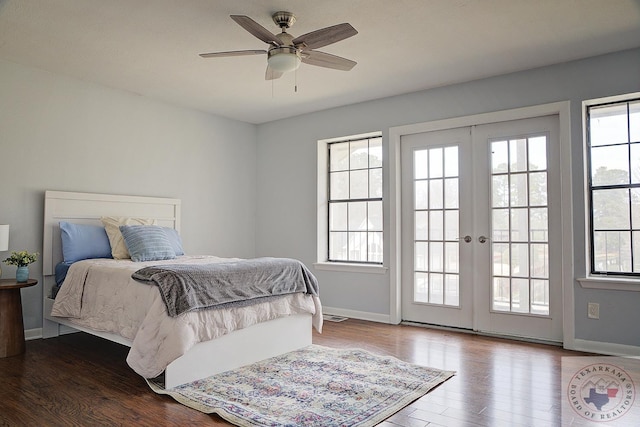 bedroom with access to outside, french doors, multiple windows, and wood finished floors