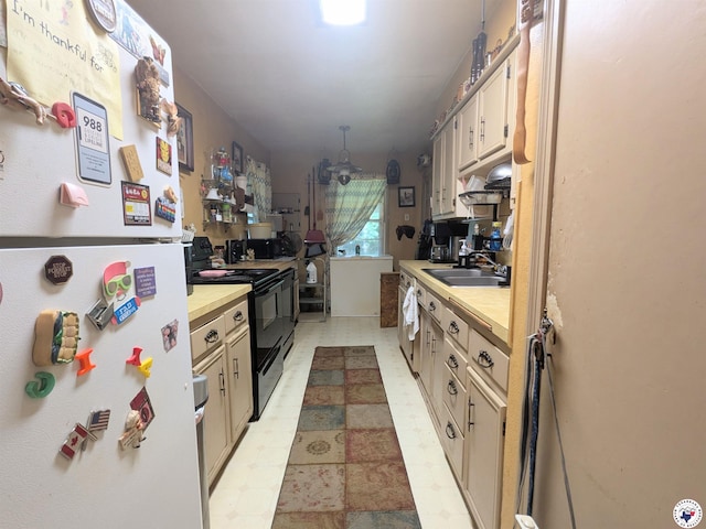 3319 Rhozine Ln, Texarkana, TX 75503 - kitchen featuring freestanding refrigerator, black range with electric cooktop, light floors, and wood counters