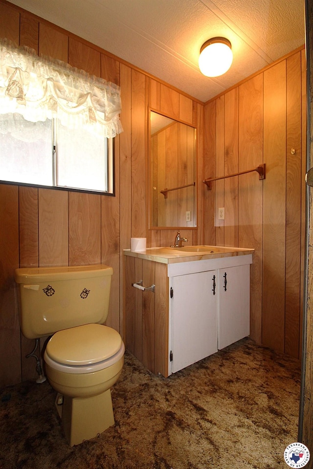 334 Pine Valley Rd, Texarkana, TX 75501 - half bathroom featuring vanity and wooden walls