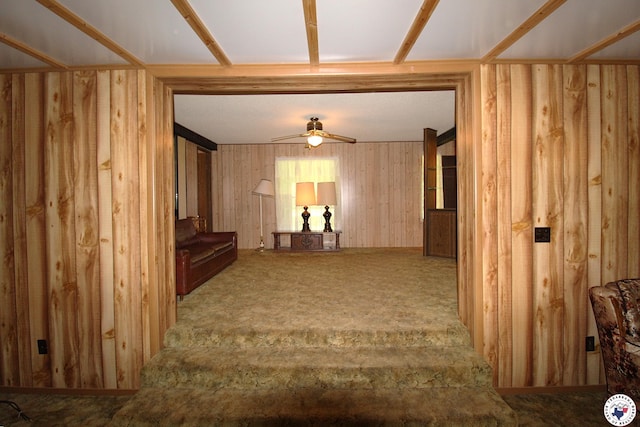 334 Pine Valley Rd, Texarkana, TX 75501 - unfurnished living room with ceiling fan, carpet floors, and wooden walls