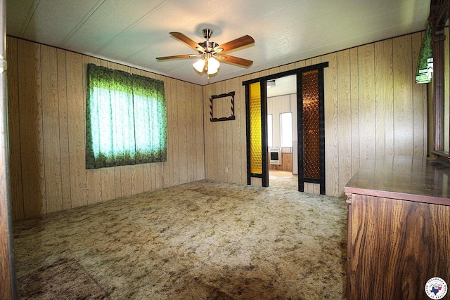 334 Pine Valley Rd, Texarkana, TX 75501 - empty room featuring carpet floors, ceiling fan, and wooden walls