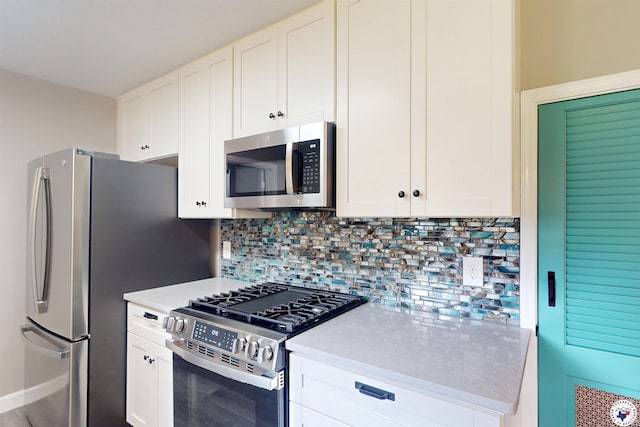 403 Edgewood Ln, Wake Village, TX 75501 - kitchen with stainless steel appliances, backsplash, white cabinetry, and light countertops