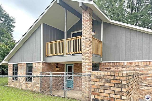 403 Edgewood Ln, Wake Village, TX 75501 - view of side of home featuring a balcony and brick siding