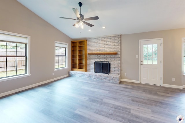 403 Edgewood Ln, Wake Village, TX 75501 - unfurnished living room with wood finished floors, a ceiling fan, built in features, a fireplace, and baseboards
