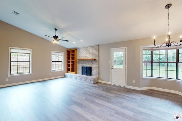 403 Edgewood Ln, Wake Village, TX 75501 - unfurnished living room featuring a chandelier, lofted ceiling, wood finished floors, a ceiling fan, and baseboards
