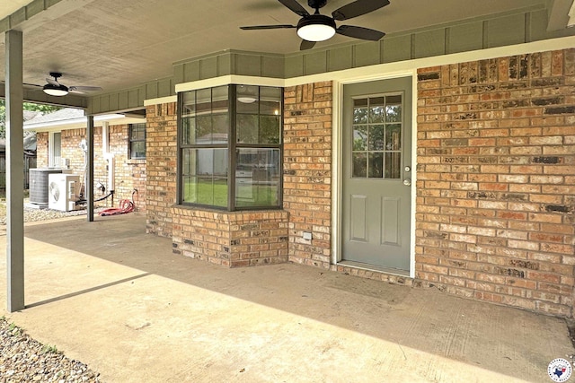 403 Edgewood Ln, Wake Village, TX 75501 - property entrance featuring a ceiling fan, brick siding, and a patio