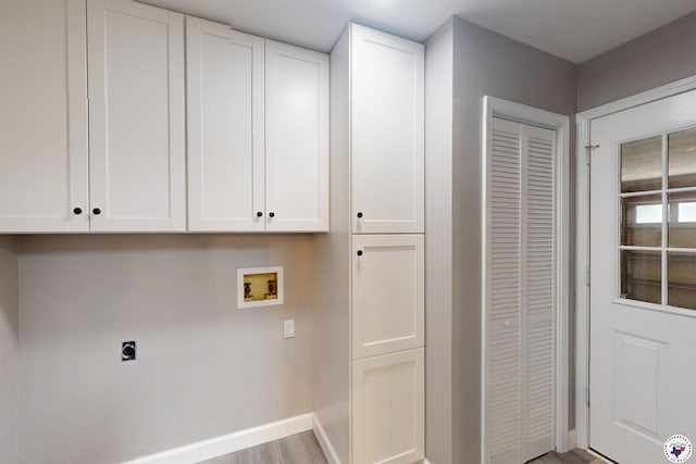 403 Edgewood Ln, Wake Village, TX 75501 - laundry area featuring hookup for a washing machine, electric dryer hookup, cabinet space, baseboards, and light wood-type flooring