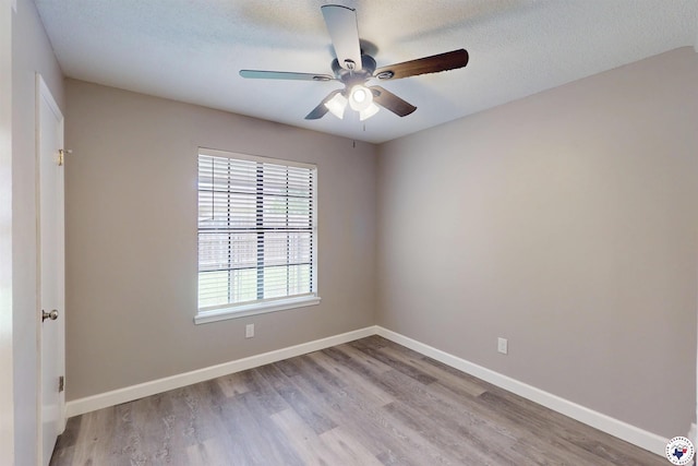 403 Edgewood Ln, Wake Village, TX 75501 - unfurnished room featuring ceiling fan, wood finished floors, baseboards, and a textured ceiling