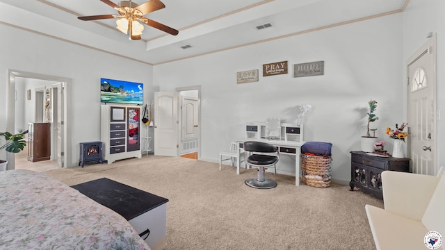 14 Stonewall Trce, Texarkana, TX 75503 - carpeted bedroom with a wood stove, a high ceiling, ceiling fan, and a raised ceiling