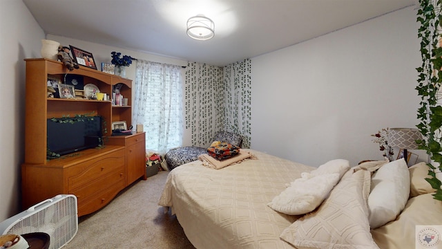 bedroom featuring light carpet