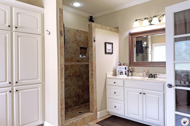220 Quail Trl, Texarkana, TX 75501 - bathroom featuring crown molding, vanity, baseboards, and a tile shower