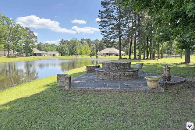 220 Quail Trl, Texarkana, TX 75501 - view of yard featuring a water view, a patio, and an outdoor fire pit