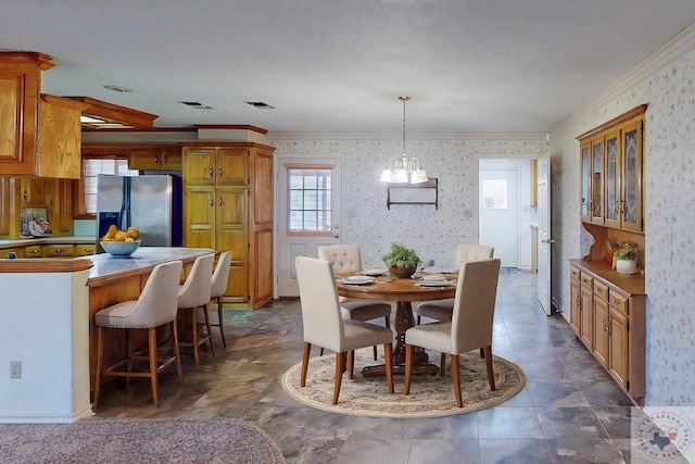 dining space featuring ornamental molding