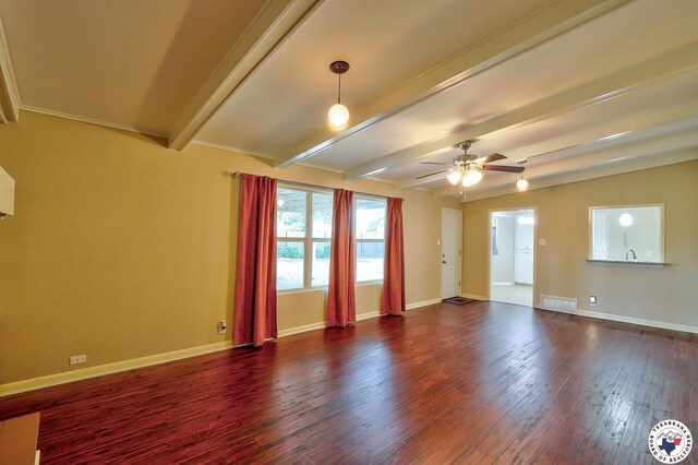 4101 Columbia Ave, Texarkana, TX 75503 - unfurnished room featuring beamed ceiling, dark wood-type flooring, a ceiling fan, and baseboards