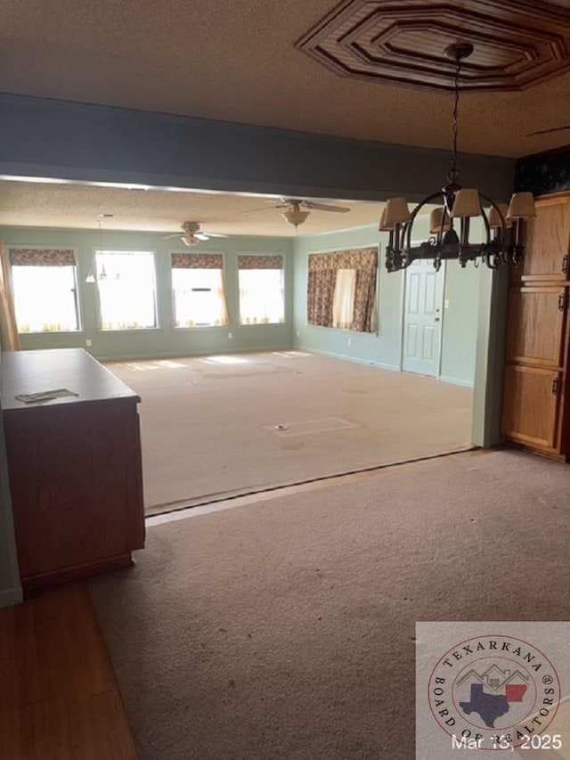 spare room featuring visible vents, carpet flooring, and a textured ceiling