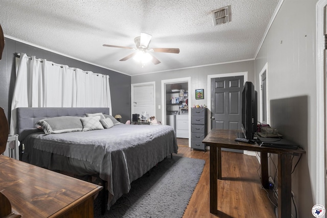 1324 Linden Ave, Texarkana, AR 71854 - bedroom with crown molding, a textured ceiling, wood finished floors, and a ceiling fan