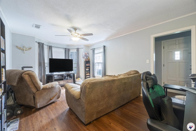1324 Linden Ave, Texarkana, AR 71854 - living room with a textured ceiling, ceiling fan, ornamental molding, and wood finished floors