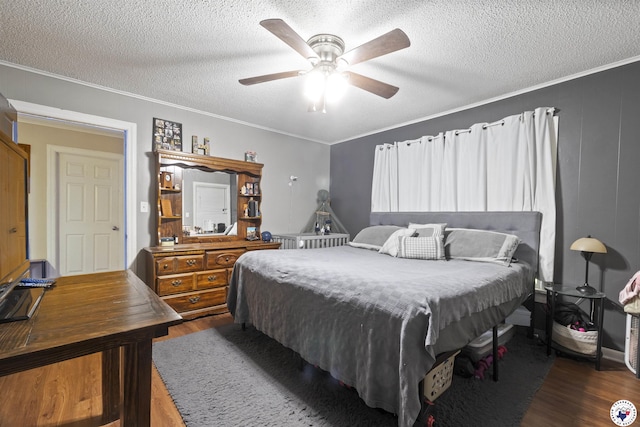 1324 Linden Ave, Texarkana, AR 71854 - bedroom featuring dark wood finished floors, a textured ceiling, ornamental molding, and ceiling fan